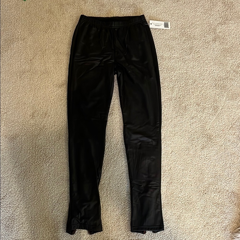 Black fleece lined Faux Leather Pants with zipper bottom detail